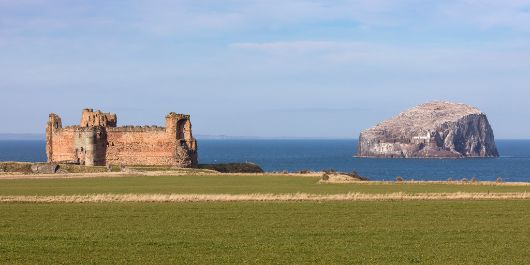 Tantallon castle with Bass Rock in the distance