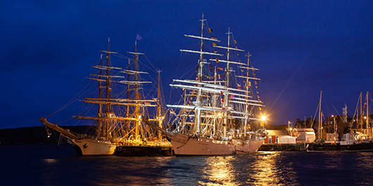 tall ships in water during night