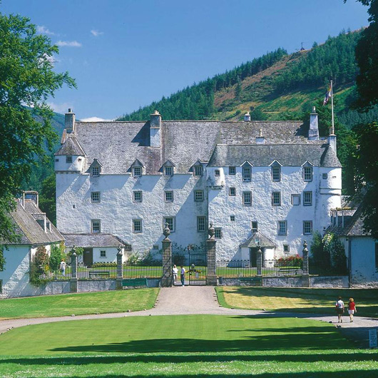 Traquair House, Innerleithen is a White castle with rolling green lawns